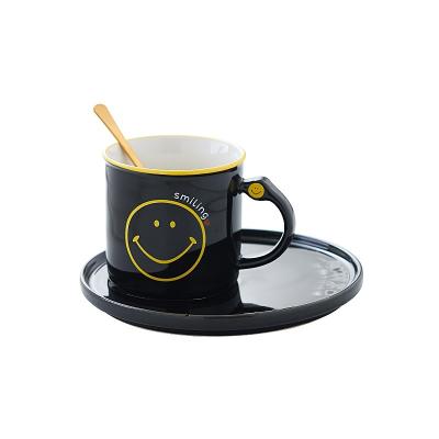 China Eco-Friendly Fashion Sustainable Low Price Cartoon Coffee Cup And Saucer Set Cute Smiling Ceramic Cup for sale