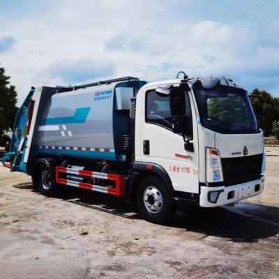 Chine Nouveau camion de nettoyage de déchets du camion à ordures 10ton de compacteur d'ascenseur de Sinotruck Howo 6wheel à vendre