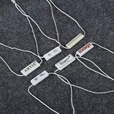 China Hang Tags Fastener Custom Design Durable Plastic Apparel Garment String Tag for sale