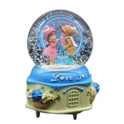 China Global low price top quality resin water snow globe with custom logo for Valentine's Day for sale