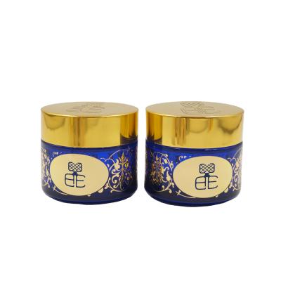 China Custom Blue Personal Care Color 100G Coating Bakhoor Gold Jar Logo Cream Jar Glass Bottles for sale