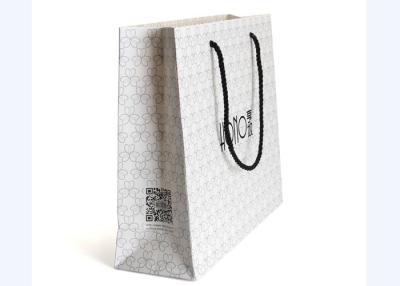 China Coated Paper Shopping Bags Customized Size With Durable Black Handles for sale