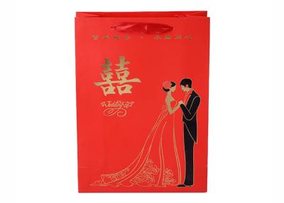 China Gold Foil Logo Paper Gift Bags With Ribbon Handle For Wedding for sale