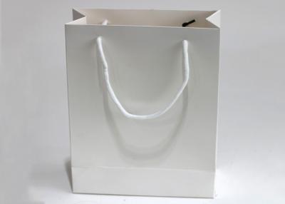 China Enviornmental Offset Printed White Kraft Paper Bags With Rope Handle for sale