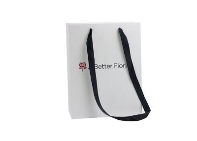 China Elegant Enviroment-Friendly Paper Shopping Bags With Long Handle For Cloth for sale