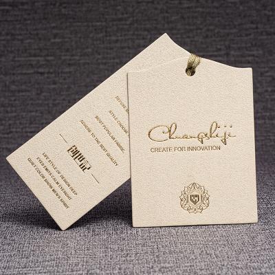 China Sustainable Custom Embossed Logo Paper Card Recycled Garment Tags Paper Hang Tag for sale