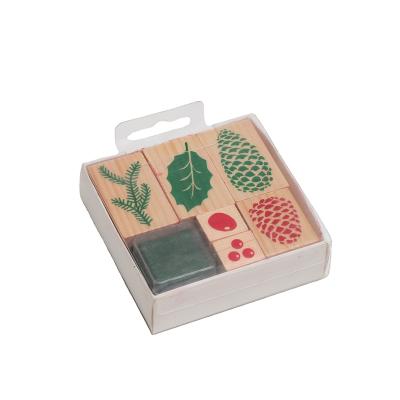 China DIY Eco-friendly Pattern Stationery Wholesale Cone Pine Leaves Rubber Wooden Stamps for sale