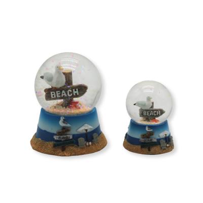 China Spain theme souvenir resin bird waymark caribbean nautical snow globe for sale