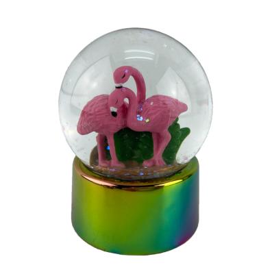 China Europe Customized Snowglobe Plating Flamingo Snow Globe For Souvenir Gift for sale