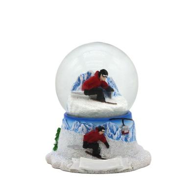 China New Resin World Snow Mountain Souvenir Winter Snow Skiing Globe for sale