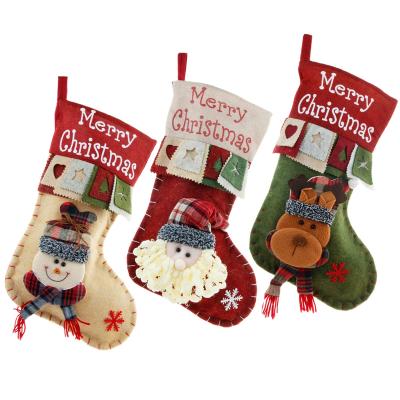 China Custom Eco-Friendly Materials Merrychristmas Large Christmas Stocking Santa Snowman Stereo Decoration Gift Bags Gift Bags for sale