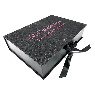 China Unique Handmade Logo Glitter Wig Weave Gift Custom Packaging Boxes Wholesale Book Shape Wigs Hair Extension Box With Red Ribbon Closure for sale