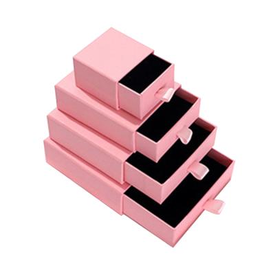 China Recycled Materials Wholesale Small Earring Ring Cardboard Packaging Boxes Women Jewelry Set Drawer Gift Pink Paper Box With Ribbon Handle for sale