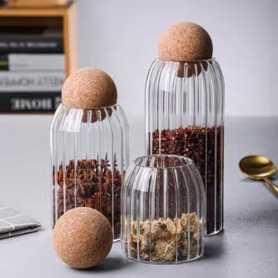 China Hot Selling Round Clear Freshness Preservation Heat Safe Borosilicate Glass Kitchen Food Spice Storage Jar Set With Wooden Cork Ball Stopper Lid for sale