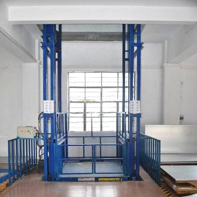 China hydraulic warehouse storage guide rail cargo lift cargo lifting table zu verkaufen