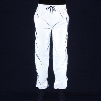 China Waterproof Men's Jogger Reflective Loose Pants With Drawstring Streetwear Hip-Hop Track Noctilucent Loose Reflective Trousers for sale