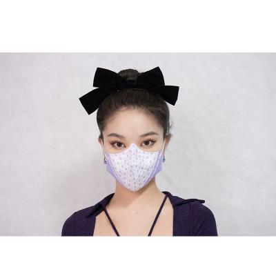 China Disposable Light Purple Color Fashion Printing Non Woven Fabric KN95 Masks Face Mask for sale