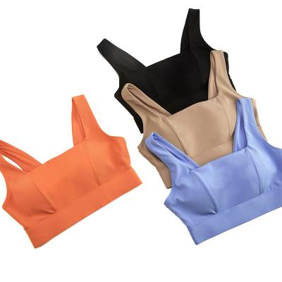 China Women's Seamless Yoga Bra Stretch Button Four Way Border Sports Underwear Bra Mold Adjustable Back One-Piece Cup for sale