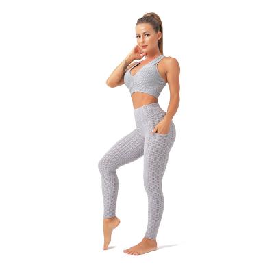 China New style waterproof yoga clothes hip-lifting bubble pants body-sculpting yoga pants bubble jacquard back bra beautiful set women for sale