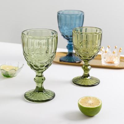 China Viable Wholesale Party 300ml Wedding Decoration Glass Cup Embossed Colored Glass Goblet Mugs for sale