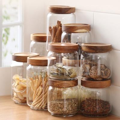 China Sustainable Amazon Hot Sale 5 Pieces Set Glass Airtight Storage Bottles Jars With Wood Seal Lid for sale