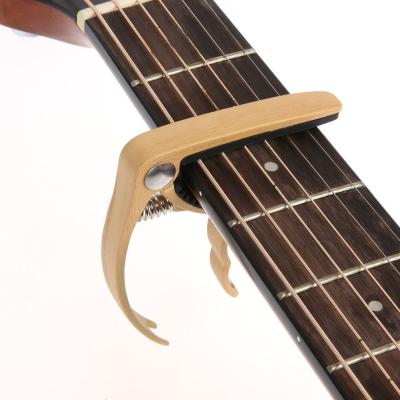 China Wooden guitar color guitar partbass guitar string guitar capo for sale