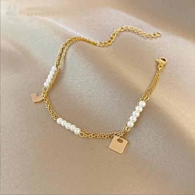 China Vintage Gold Fashion Pearl Dangling Bracelets Pearl Double-Layer Love Freshwater Bracelet for sale