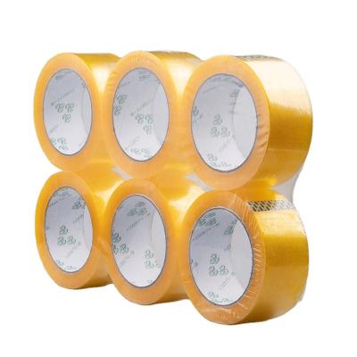 China Waterproof Transparent Super Golden Yellow Cardboard Wide Cardboard Packing Scotch Tape Jumbo Bopp Rolls Sew Adhesive Tape for sale