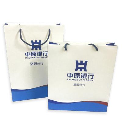 China New Creative Portable Paper Bag Recyclable Portable White Cardboard Gift Packaging Clothing Shopping Bag for sale