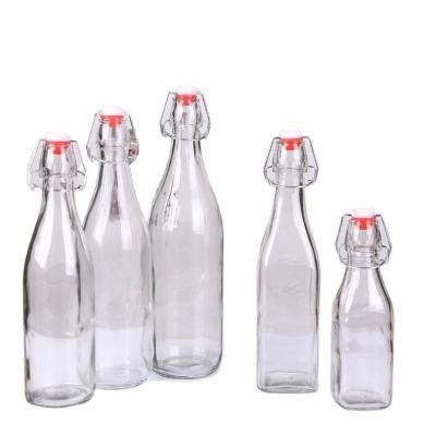 China Beverage 500ml Empty 750ml Clear 1 Liter Swing Top Beer Juice Beverage Milk Glass Kombucha Soda Bottle for sale