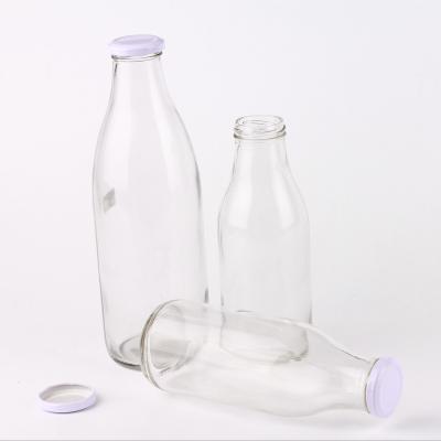 China Beverage Food Grade 1 Liter Cool Glass Milk Bottle With Lid Wholesale for sale