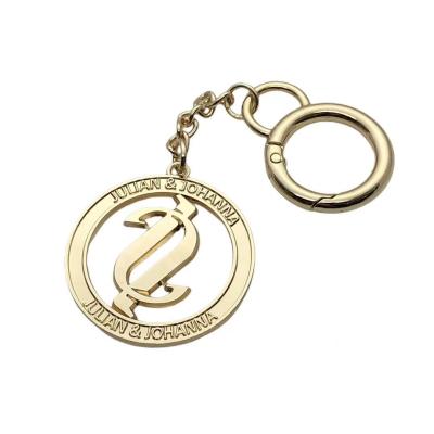 China The custom round of handbag\garment\etc. Shape Gold Flash Key Chain Metal LOGO Labels Metal Hanging Tags For Bags Handbags for sale