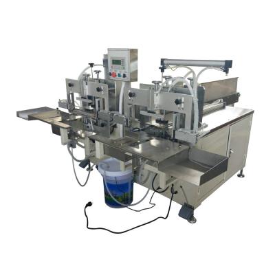 China Manual Easy Operation Napkin Tissue Paper Double Heads Bag Packing Machine en venta