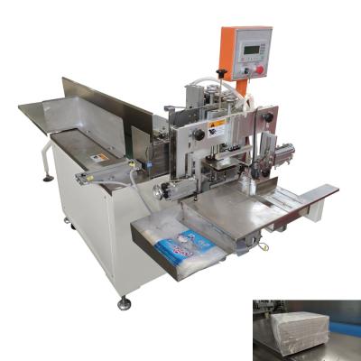 China Easy operate plastic bag table napkin tissue paper packing and sealing machine en venta