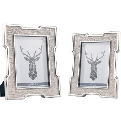 China Light Luxury Hotel Office/Bedroom Picture Frame Stainless Steel Photo Frame Custom Light Luxury Silver Frame 7 Inch Gray Leather Photo Frame for sale