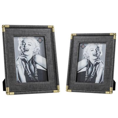 China Creative household photo hotel/living room gold metal photo frame creative household light luxury leather photo frame for sale