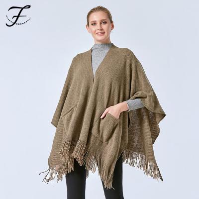 China Soft Touch Feeling Soft Solid Color Tassels Poncho Coat Cashmere Warm Shawl from FIONA Custom European and New American Women for sale