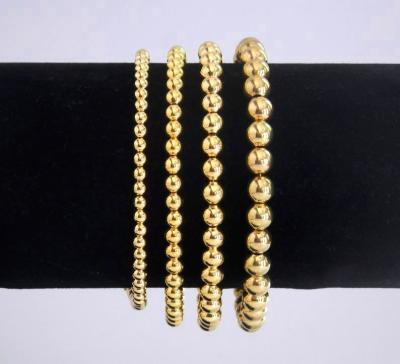 China Environmental Friendly Wholesale Lucky 14K Gold Filled Bead Beaded Stackable Bracelets Stretch Bracelet Minimalist for sale