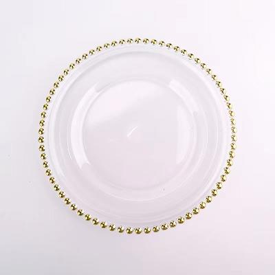 China Viable Customized Wholesale Gold Beaded Rim Transparent Glass Charger Plates Wedding Bulk for sale