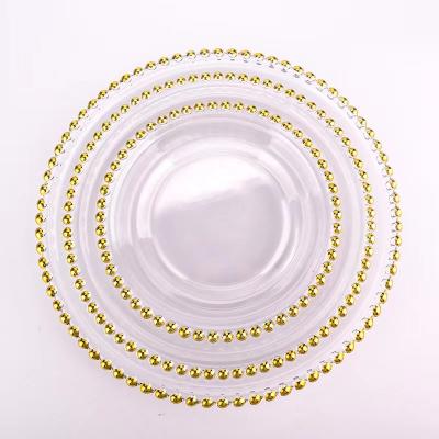 China Customized Viable Design Quality Dinner Under Decorative Silver Gold Rim Glass Heel Plate Gold Charger Dishes for sale