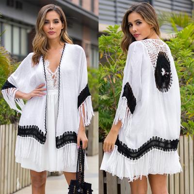 China 2020 Black And White Crochet Tassel Cardigan Holiday Wind Beach Blouse Sunscreen Clothing Loose Beach Sunscreen Anti-UV Cover Up for sale