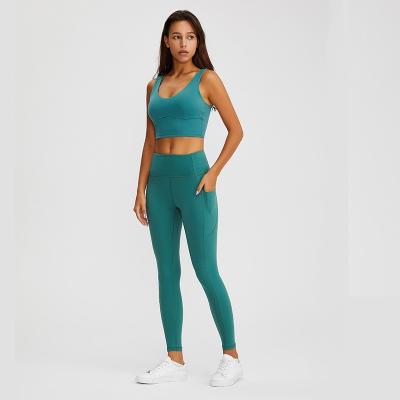 China yw53+kw40 side pocket breathable leggings + bra in same color yoga sets seamless for sale