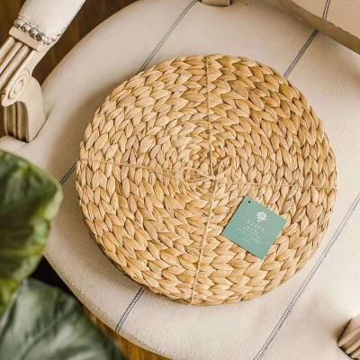 China Sustainable round rattan place mats are made from natural carpus grasseat mat for sale