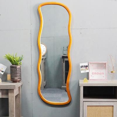 China Large Contemporary Floor Standing Mirror Full Body Wavy Shaped Dressing Mirror For Living Room for sale