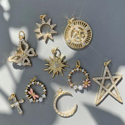 China FASHIONABLE gold plated minimalist discover weekly spotify cross moon star butterfly dragonfly bow lady charms pendants jewelry making diy for sale