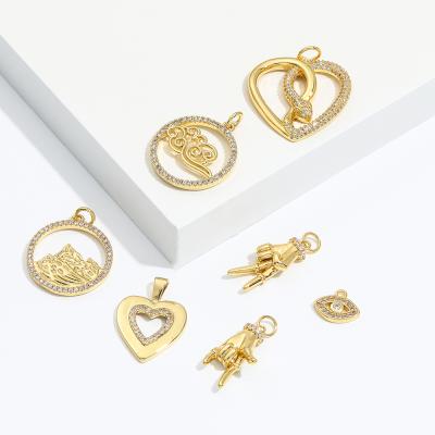 China FASHIONABLE Yiwu 18k Gold Charm Heart Eye Round Hollow Enamel Pendan Charms For Jewelry for sale