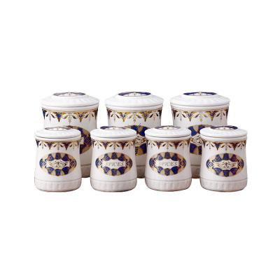 China Viable unique kitchen set of 7 pcs porcelain spice jar salt condiment dispenser canister shelf storage bottles ceramic cookware sets for sale