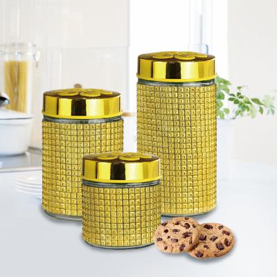 China SUSTAINABLE GLASS JAR COATED WITH PLASTIC SHEATH AND GOLD COATED LID for sale