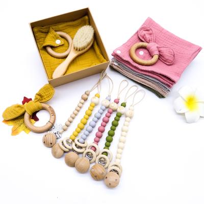 China Natural Cotton Muslin Baby Shower Gift Set Wooden Pacifier Newborn Holder Toys Baby Teether for sale