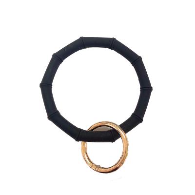 China Eco-friendly Silicone Bamboo Shape Holder Bracelets Wristband Key Ring Keychain Custom Wrist Keychain for sale